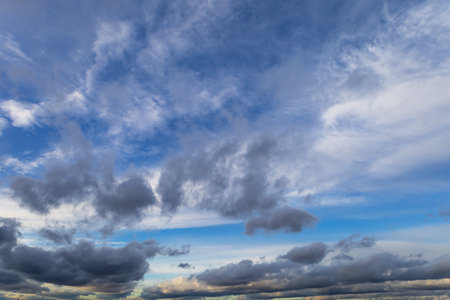 Sky with dramatic clouds. The sun shines through the clouds. The sky for exchange in the photo.