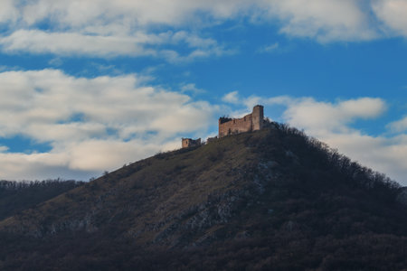 Landscape with the ruins of Devicky Castle - Moravia - Czech Republic. Blue sky with white clouds.の写真素材