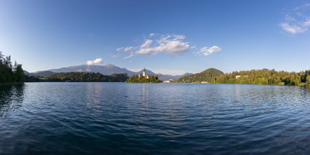 Church of the Assumption of the Virgin Mary on an island near Lake Bled in Slovenia. There are beautiful clouds in the sky.の写真素材