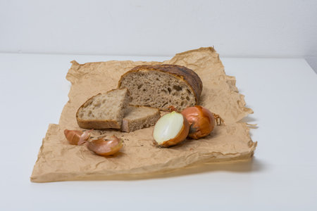 Homemade cumin bread and onions on the table