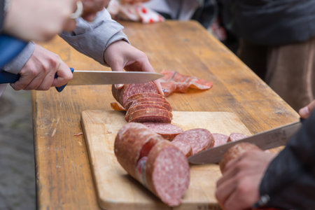 Sliced long-life salami in rollsの写真素材