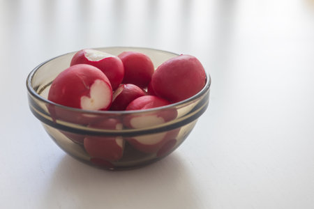 Healthy raw vegetables. Red radish in a bowlの写真素材