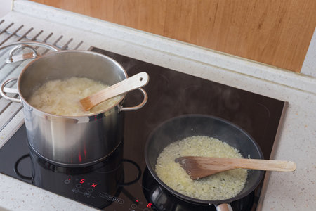 Boiled cabbage and fried onion in a panの写真素材