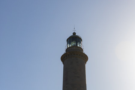 Faro de Maspalomas Spain seascape, beach and lighthouse Faro and sand dunes in Gran Canariaの写真素材