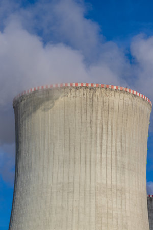 Dukovany Nuclear Power Plant in the Czech Republic, Europe. Smoke cooling towers. There are clouds in the sky. In the background the nature of the Highlands.の写真素材