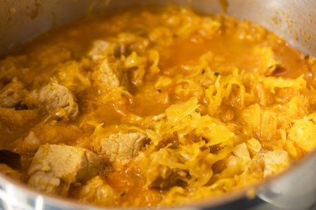 Pork is cooked in a pot with cabbage for Szeged goulashの写真素材