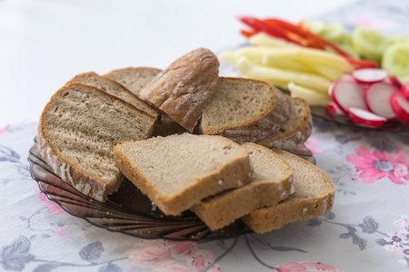 Sliced ââbread on a plate is on the breakfast tableの写真素材