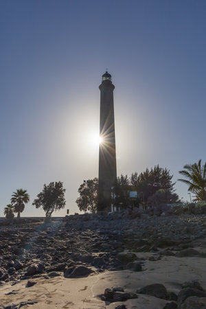 Faro de Maspalomas Spain seascape, beach and lighthouse Faro and sand dunes in Gran Canariaの写真素材