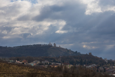 Mikulov in the South Moravian Region, Czech Republic, with a view of Holy Hill (Svaty kopecek) and the chateauの写真素材