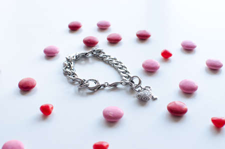 the perfect valentines gift for her a shiny bracelet with heart and chocolateの写真素材