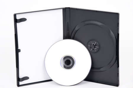 A standing open DVD case with a white DVD leaning on the caseの写真素材