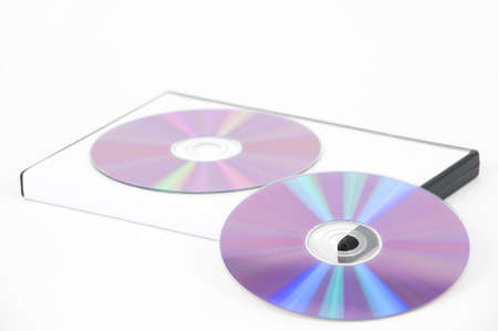 Two purple DVD leaning on the bottom of a white case on a white backgroundの写真素材