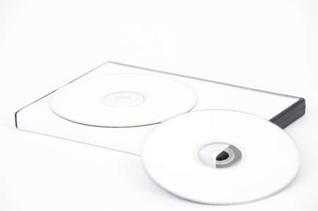 Two white DVD leaning on a white case on a white backgroundの写真素材