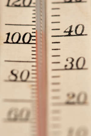 A close up of a thermometer showing a high temperature