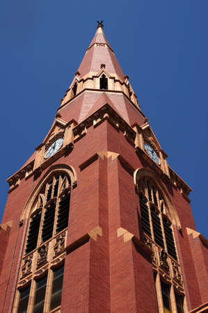 The steeple of a church with a clock on it