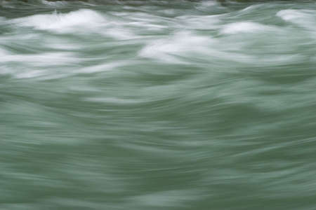 Fast moving river rapids that make a textureの写真素材