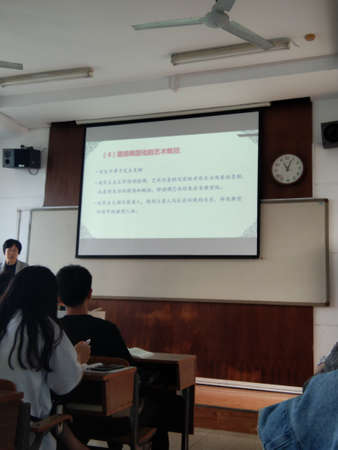 Unidentified students are watching the screen of the lesson at school.の写真素材