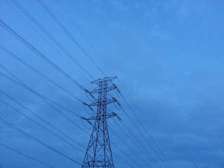 Electricity high voltage pylon and blue sky in the evening