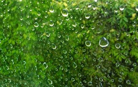 Raindrops on the glass surface. Texture of a drops of water.の写真素材