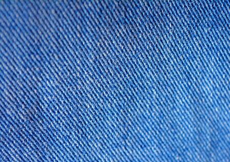 Blue jeans close up texture background. Denim blue fabric texture.
