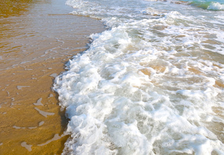 Beach with wave and blue sea water backgroundの写真素材