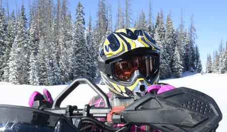 Young girl in snowmobiling helmet and gogglesの写真素材