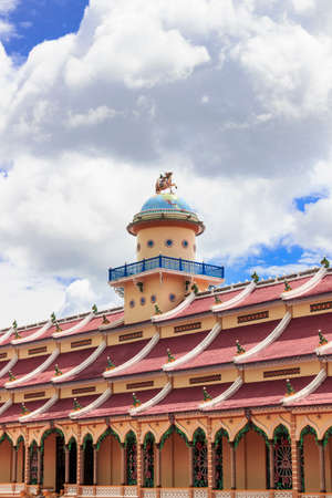 TAY NINH, VIETNAM-October 23, 2016: Cao Dai temple area and meditating followers of the Cao Dai religion in the temple Cao Daiのeditorial素材