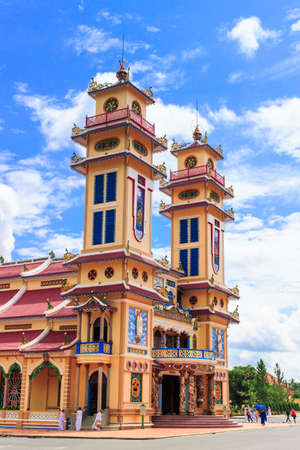 TAY NINH, VIETNAM-October 23, 2016: Cao Dai temple area and meditating followers of the Cao Dai religion in the temple Cao Daiのeditorial素材