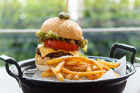 At the delicious fresh hamburger fashionable restaurant balcony seatsの写真素材