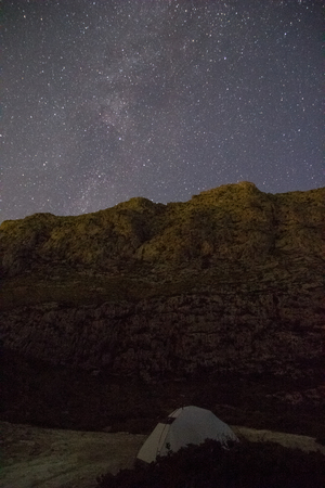 Night sky over tent in mountains of Mallorca Island, Spainの写真素材