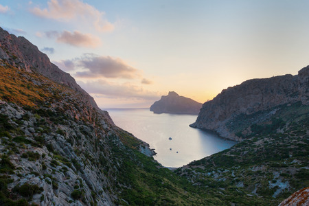 Beautiful pastel orange sunrise over Cap de Formentor on Mallorca island, Spainの写真素材