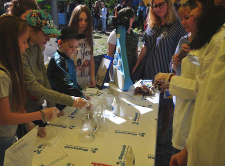 Participants of Sochi Open Fest festival through the end of 2018 conduct chemical experiments at the stand of the network of clubs of young chemists "Faraday". SOCHI, RUSSIAのeditorial素材