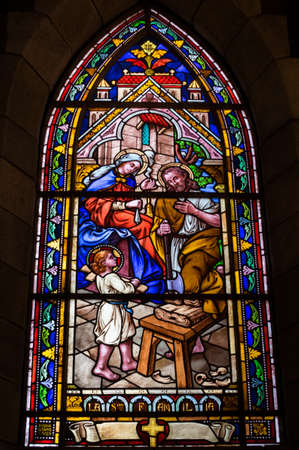 BARILOCHE, ARGENTINA - MARCH 10, 2014 - Stained glass window inside catholic church, Nahuel Huapi Cathedralのeditorial素材