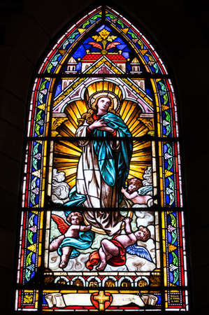 BARILOCHE, ARGENTINA - MARCH 10, 2014 - Stained glass window inside catholic church, Nahuel Huapi Cathedralのeditorial素材
