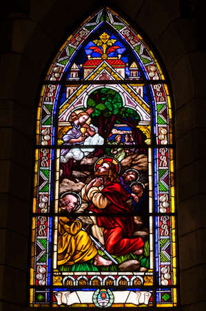 BARILOCHE, ARGENTINA - MARCH 10, 2014 - Stained glass window inside catholic church, Nahuel Huapi Cathedralのeditorial素材