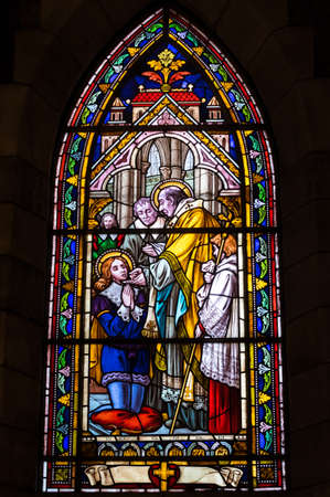 BARILOCHE, ARGENTINA - MARCH 10, 2014 - Stained glass window inside catholic church, Nahuel Huapi Cathedralのeditorial素材
