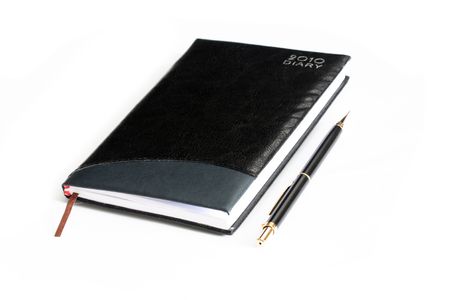 Closed Black Leather Notebook and penの写真素材