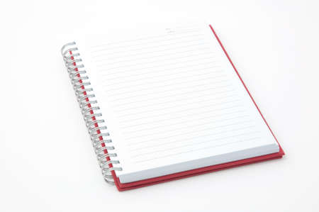open red note book on white backgroundの写真素材