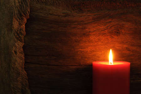 candle light on wood backgroundの写真素材