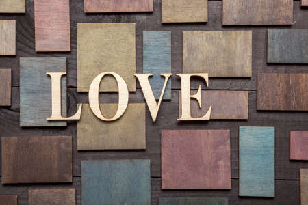 Wooden letters forming word LOVE written on wooden backgroundの写真素材