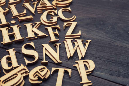 Wooden letters on dark wooden backgroundの写真素材