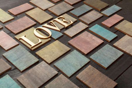 Wooden letters forming word LOVE written on wooden backgroundの写真素材