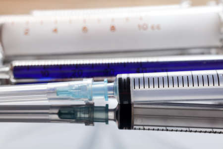 Old glass syringes in laboratory environmentの写真素材