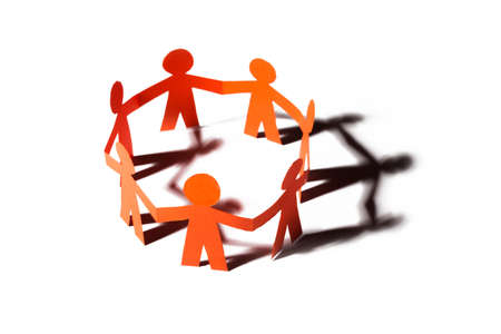 Group of paper doll holding hands. Teamwork concept paper craft. Orange dolls on white background


