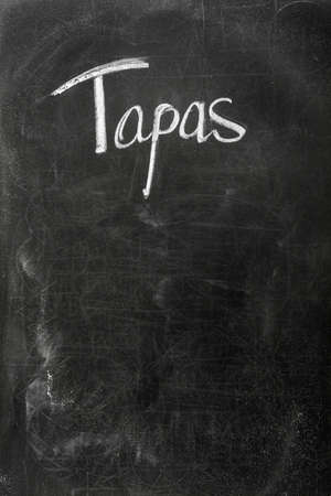 Menu on the blackboard showing what is available. Spanish tapasの写真素材