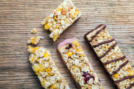 Cereal bars on a wooden tableの写真素材