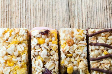Cereal bars on a wooden tableの写真素材
