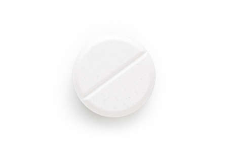 Macro shoot of single white pill isolated on white background.の写真素材
