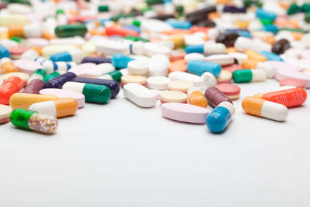 Pills and capsules on white backgroundの写真素材