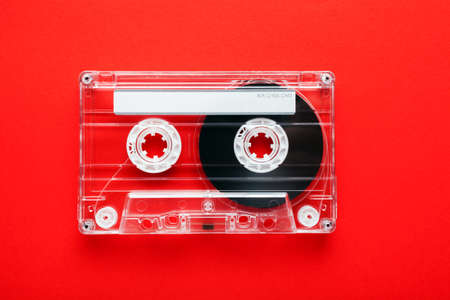 Audio tape cassette on red backgroundの写真素材